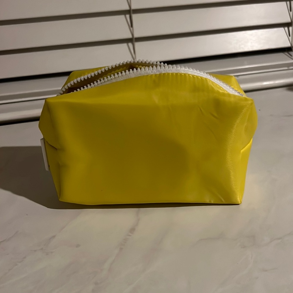 Supergoop travel bag